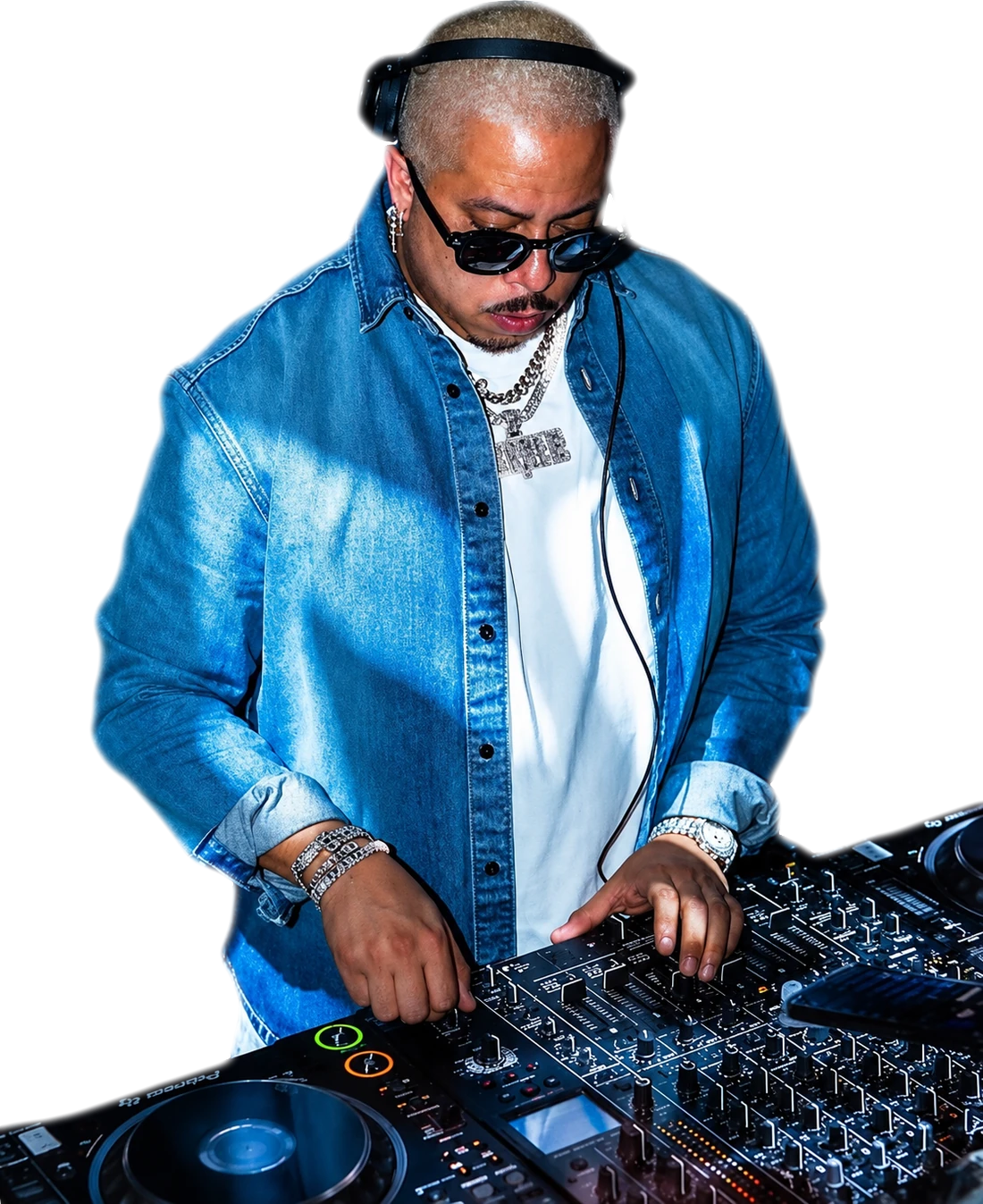 PURPLE in a denim jacket mixing on the decks