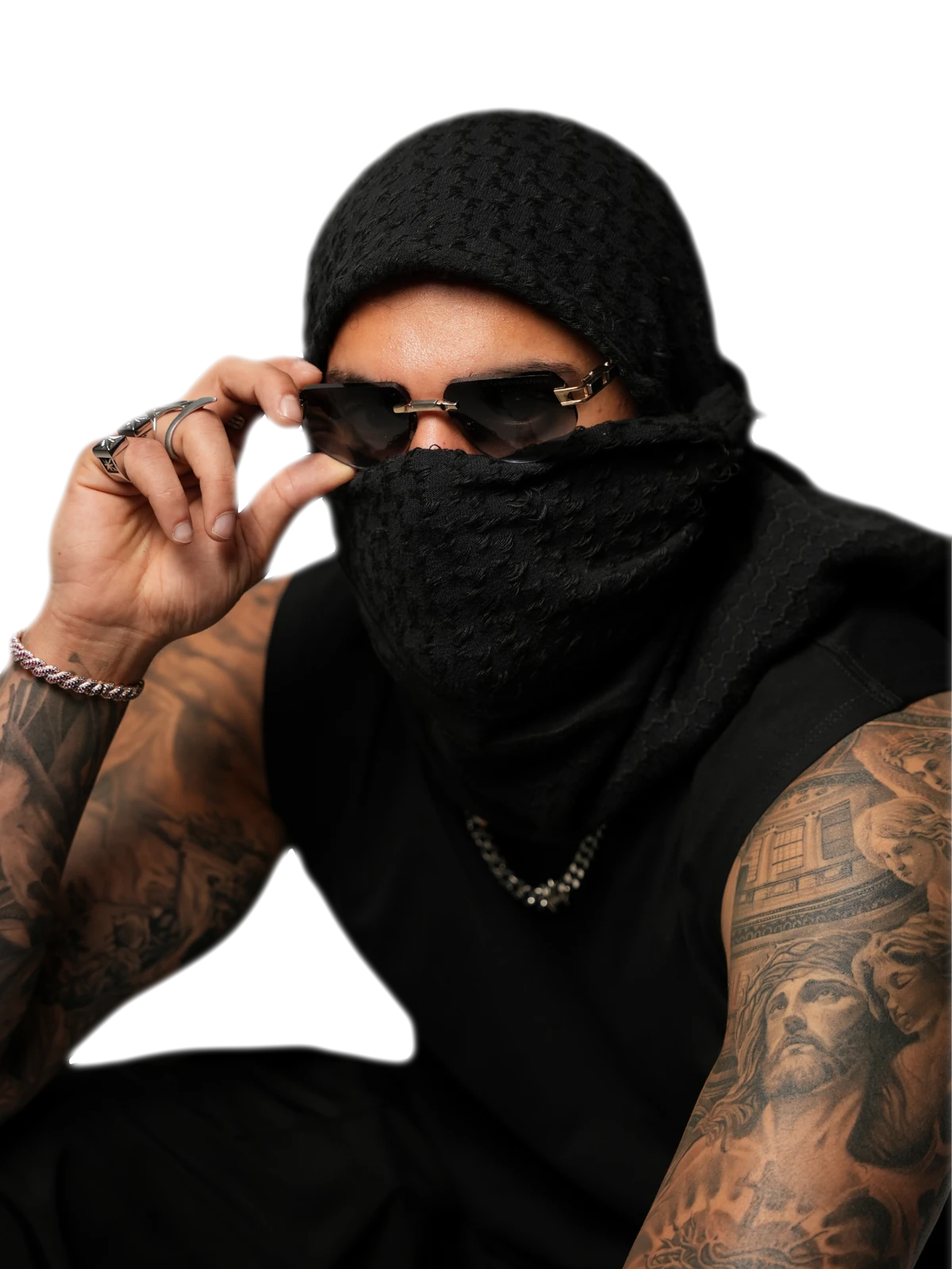 YALLA HABEBE in a black scarf mask and sunglasses, lifting his glasses