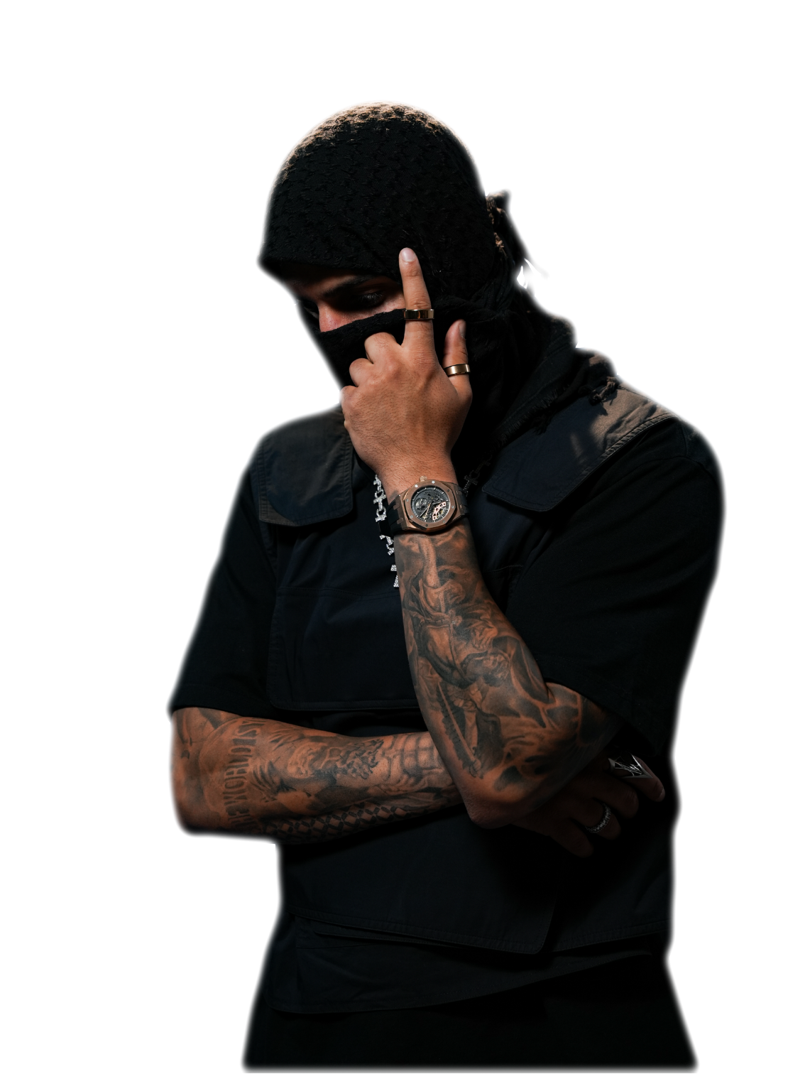 YALLA HABEBE in a black balaclava, hand raised to his chin
