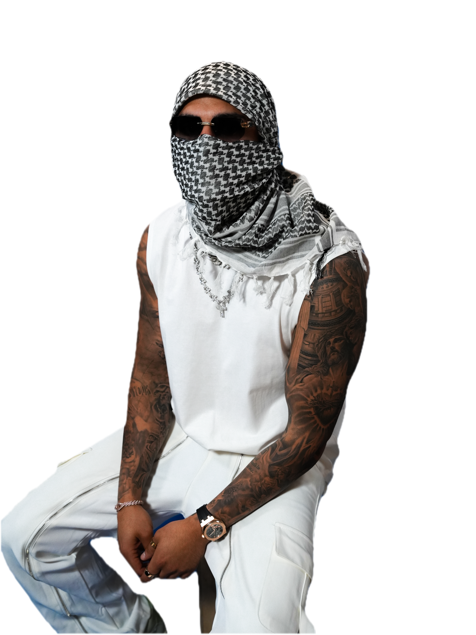 YALLA HABEBE, cut out against the page background, in a checkered scarf mask and white outfit